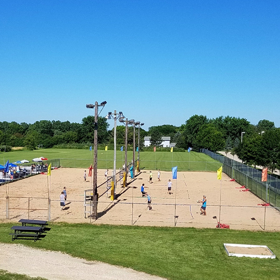 big outdoor space with large sand volleyball courts